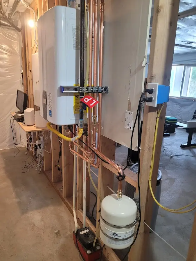 Licensed plumber repairing a kitchen sink in Andover